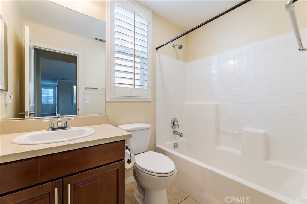 26459 Riverrock Way Saugus, CA 91350 - Photo 22 of 60 a bathroom with a sink toilet vanity and shower