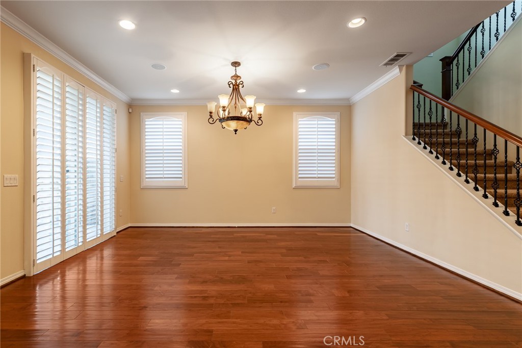 26459 Riverrock Way Saugus, CA 91350 - Photo 24 of 60 a view of an empty room with wooden floor and a window