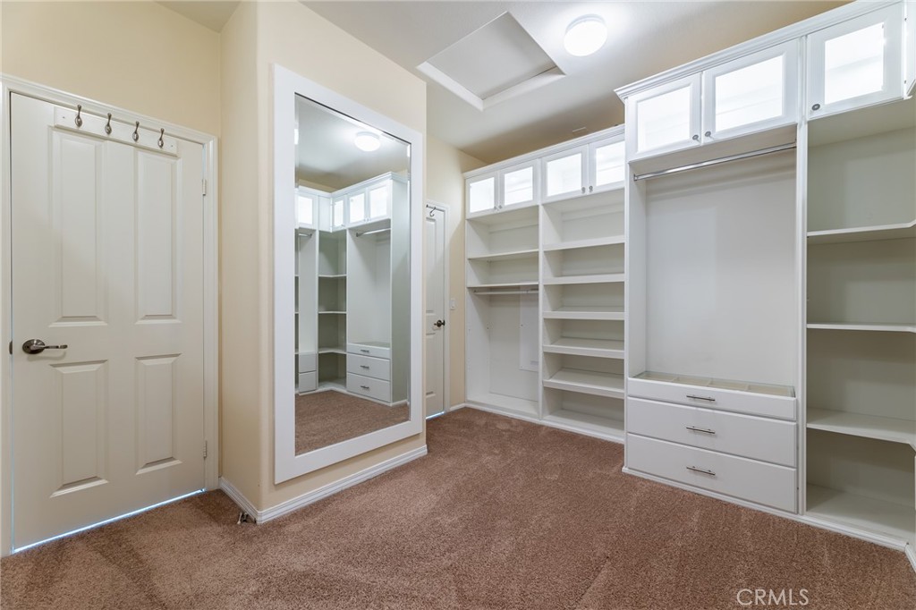 26459 Riverrock Way Saugus, CA 91350 - Photo 44 of 60 a view of an empty room with cabinet and a window