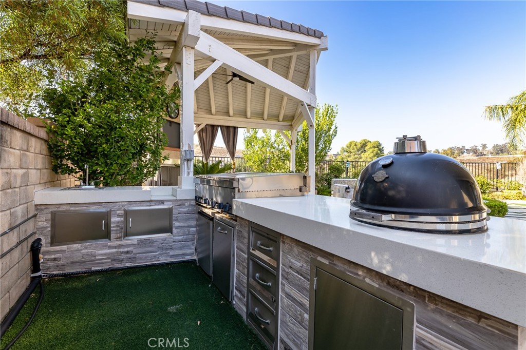 26459 Riverrock Way Saugus, CA 91350 - Photo 50 of 60 a view of a house with a sink and outdoor kitchen