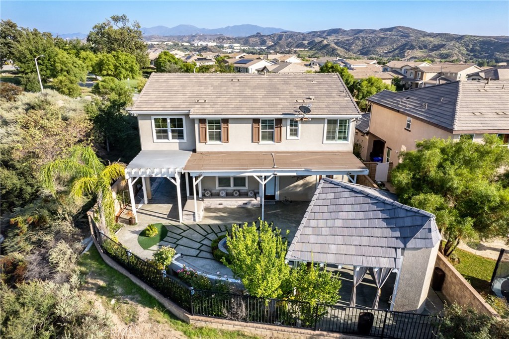 26459 Riverrock Way Saugus, CA 91350 - Photo 5 of 60 an aerial view of a house with swimming pool and a yard