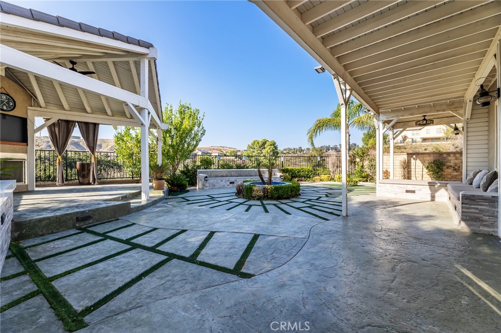 26459 Riverrock Way Saugus, CA 91350 - Photo 51 of 60 a view of a patio with a table and chairs and potted plants