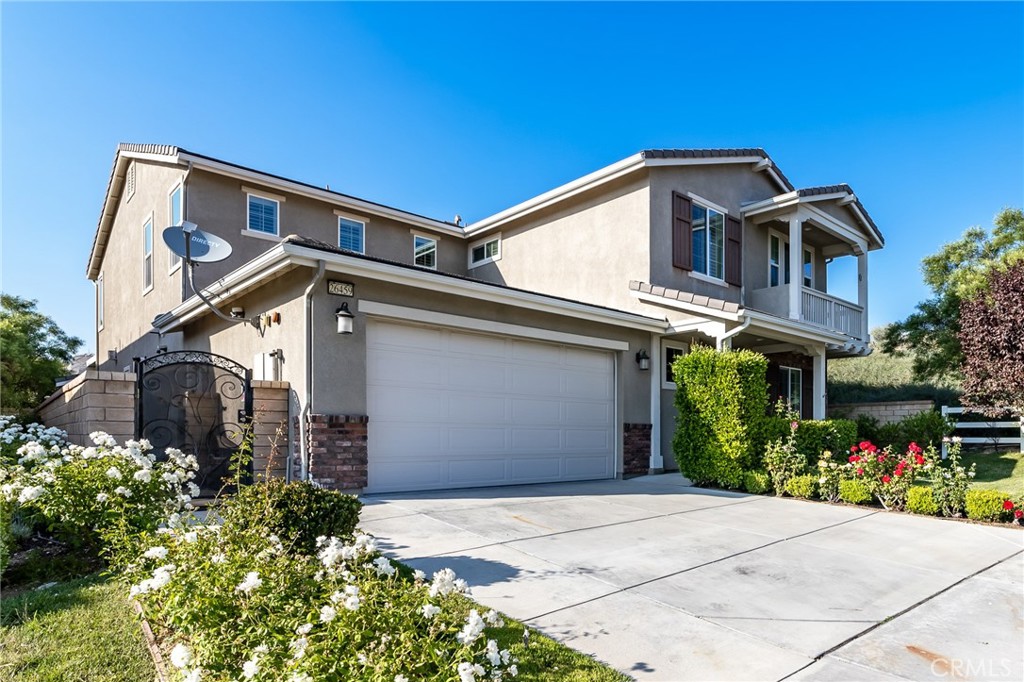 26459 Riverrock Way Saugus, CA 91350 - Photo 55 of 60 a front view of a house with a yard