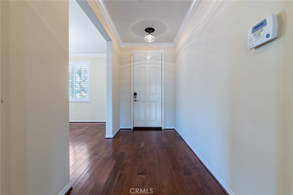 26459 Riverrock Way Saugus, CA 91350 - Photo 8 of 60 a view of a hallway with wooden floor