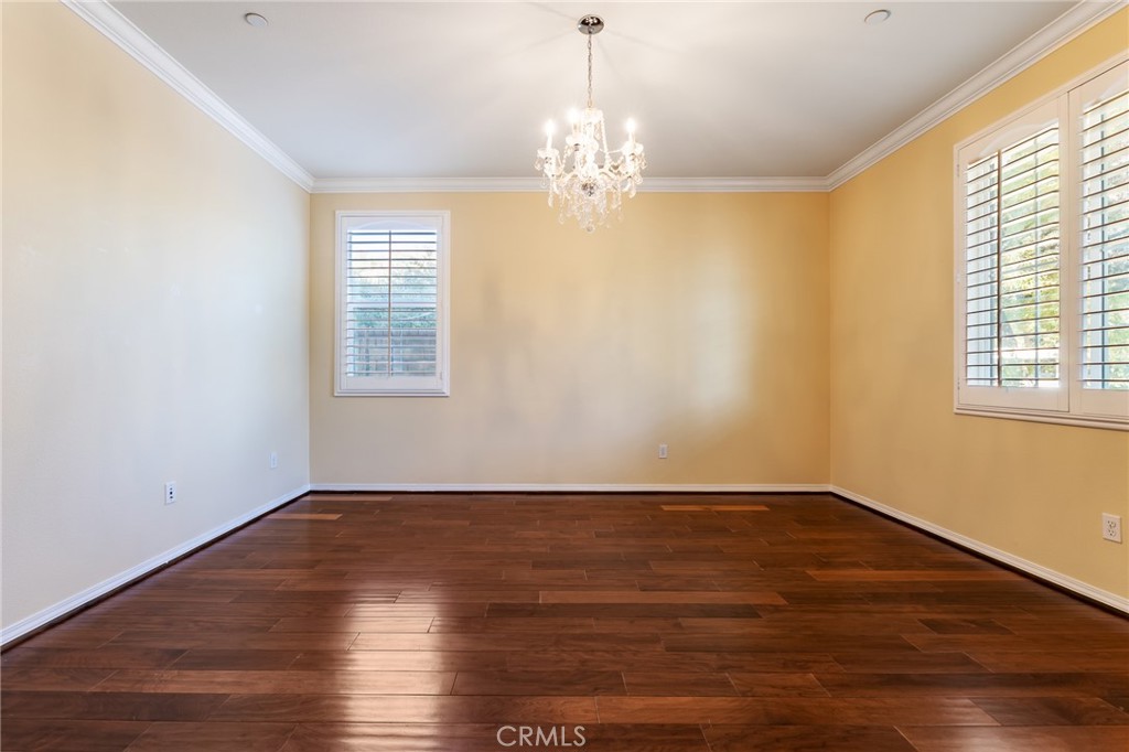 26459 Riverrock Way Saugus, CA 91350 - Photo 9 of 60 a view of an empty room with wooden floor and a window