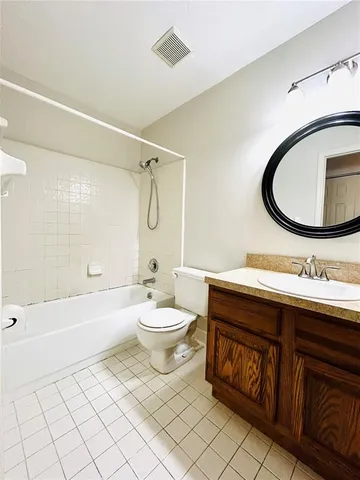 a bathroom with a toilet a sink and bathtub