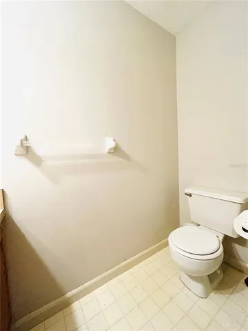 a bathroom with a toilet and a vanity