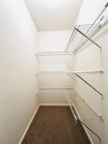a view of an empty walk in closet