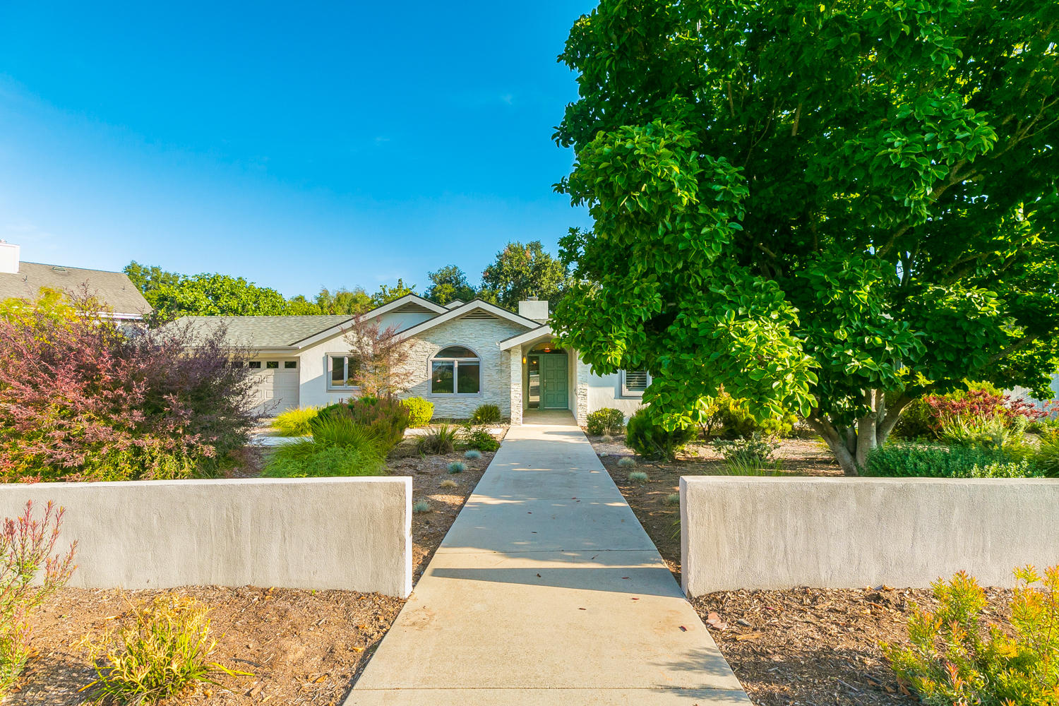 front view of a house with a garden