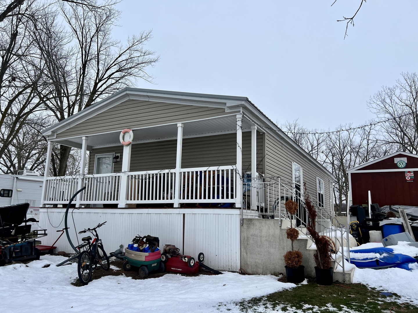 27 Lakeview Road Gays, IL 61928 - Photo 2 of 26 a view of a house with a patio and a car parked in a yard