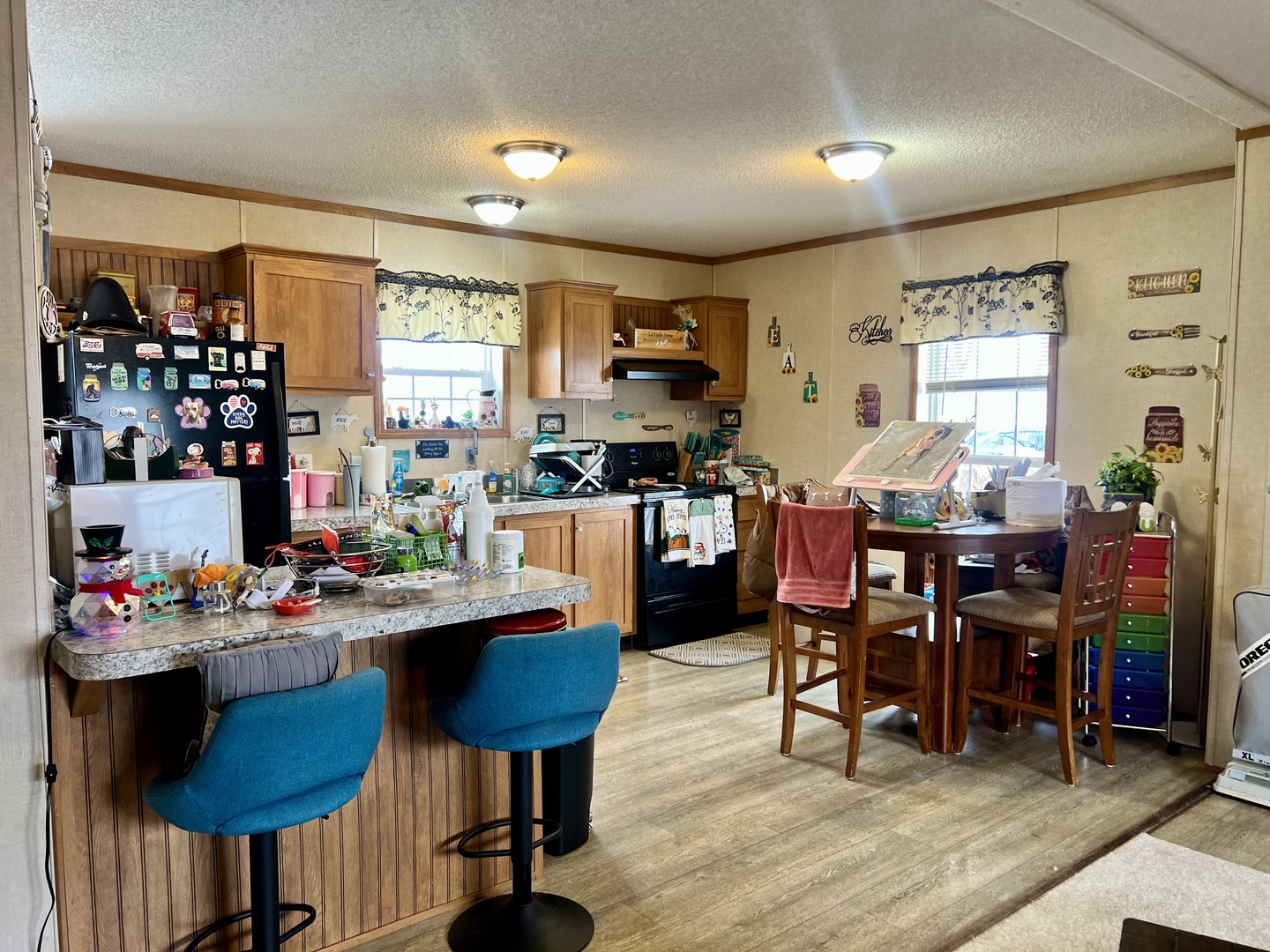 27 Lakeview Road Gays, IL 61928 - Photo 10 of 26 a room with stainless steel appliances kitchen island granite countertop furniture and a dining table