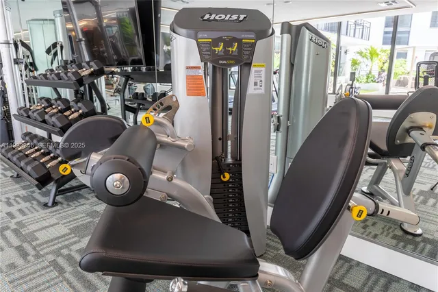 a living room with kitchen island furniture and a potted plant