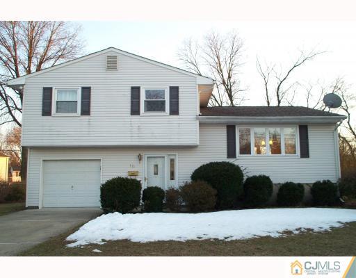 10 Sulliman Road Edison, NJ 08817 - Photo 1 of 9 a front view of a house with a yard
