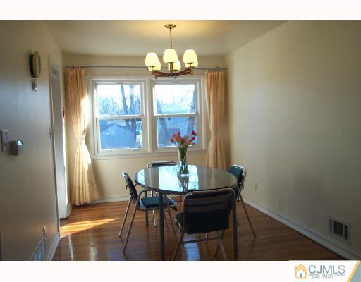 10 Sulliman Road Edison, NJ 08817 - Photo 5 of 9 a dining room with furniture and window