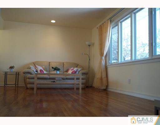 10 Sulliman Road Edison, NJ 08817 - Photo 7 of 9 a living room with furniture and a window