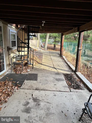 a view of a porch with wooden floor