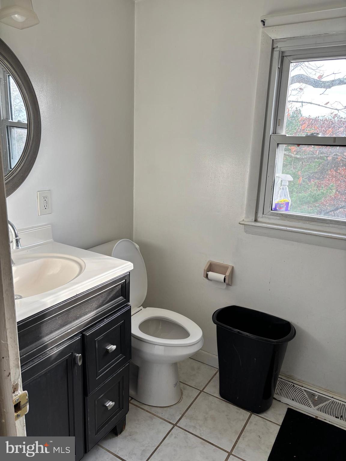 148 Diamond Avenue Pine Hill, NJ 08021 - Photo 23 of 35 a bathroom with a toilet a sink and a window