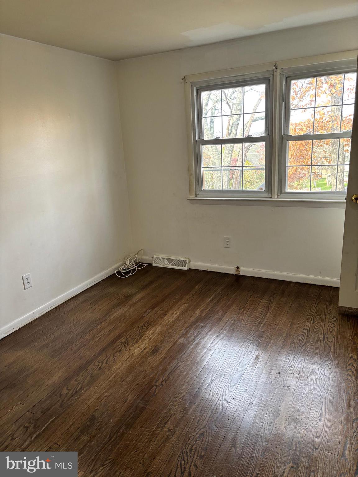 148 Diamond Avenue Pine Hill, NJ 08021 - Photo 26 of 35 an empty room with wooden floor and windows