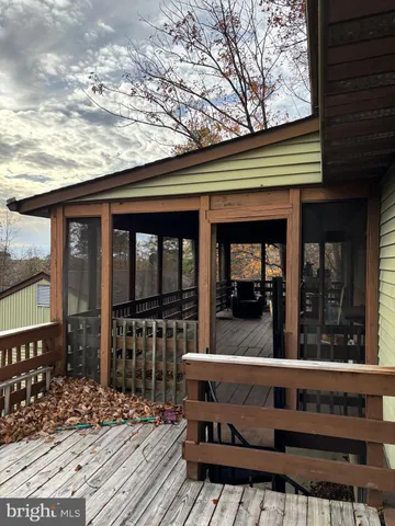 a view of an chairs and deck in the house