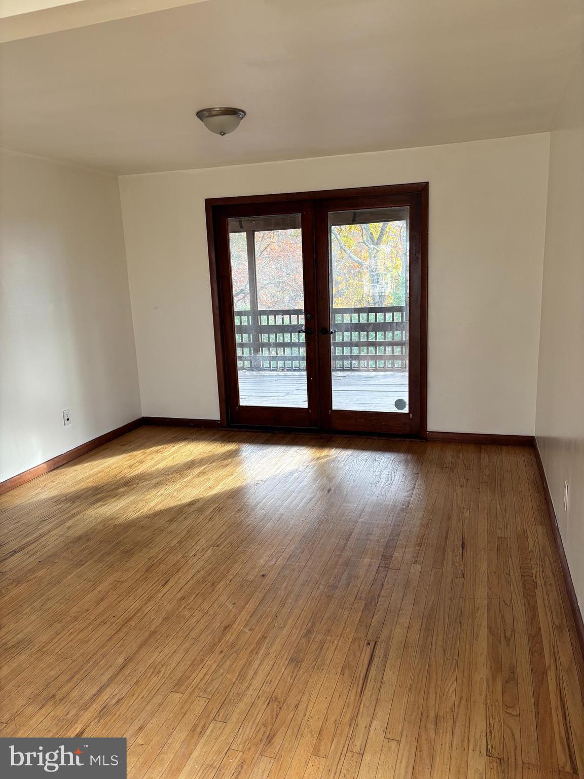 148 Diamond Avenue Pine Hill, NJ 08021 - Photo 4 of 35 a view of an empty room with wooden floor and a window
