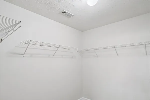 a view of a room with racks on the wall