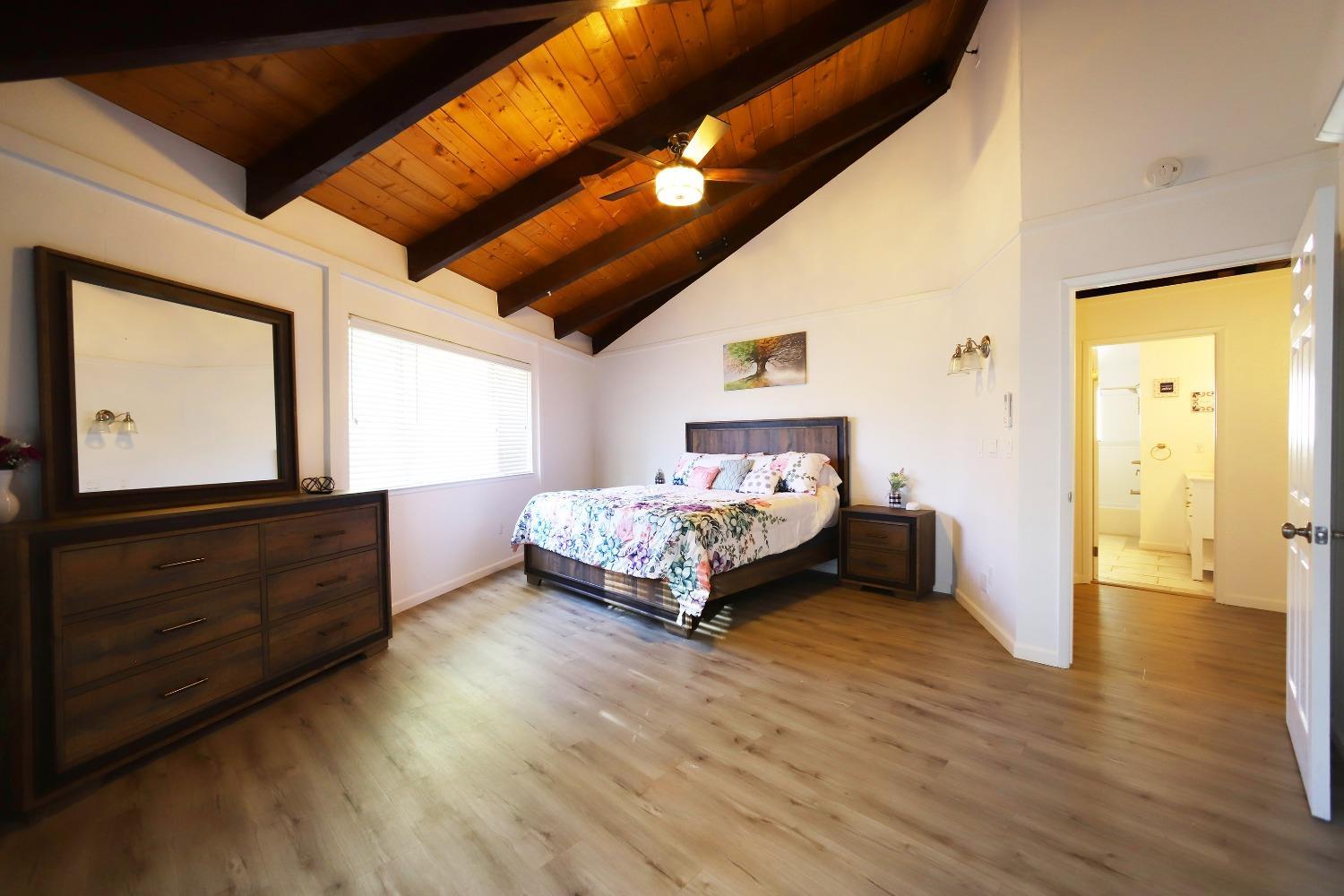 1870 Cable Road Camino, CA 95709 - Photo 12 of 36 a bedroom with a bed and wooden floor