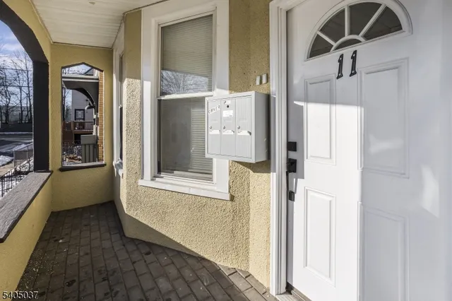 a view of front door and bedroom