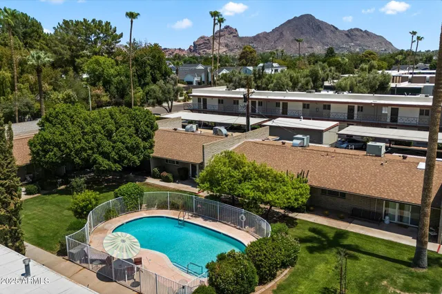 an aerial view of a house with a garden