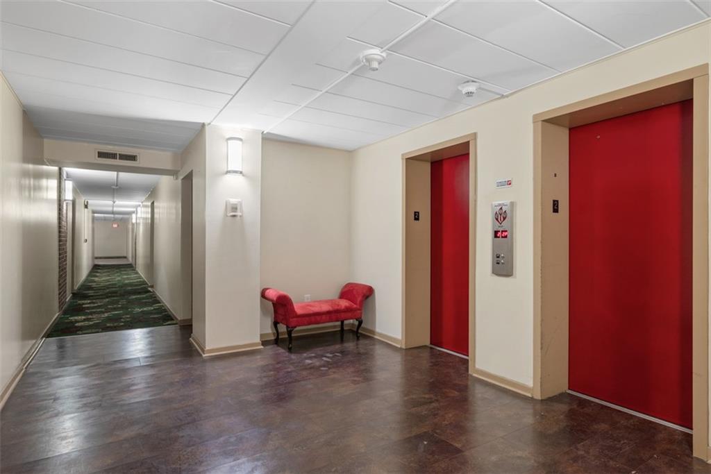 5 Bayard Road, Unit 219 Pittsburgh, PA 15213 - Photo 4 of 35 a hallway with furniture and wooden floor