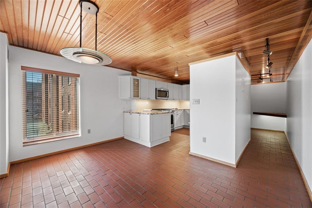 5 Bayard Road, Unit 219 Pittsburgh, PA 15213 - Photo 10 of 35 a view of kitchen with stainless steel appliances wooden floor and a refrigerator