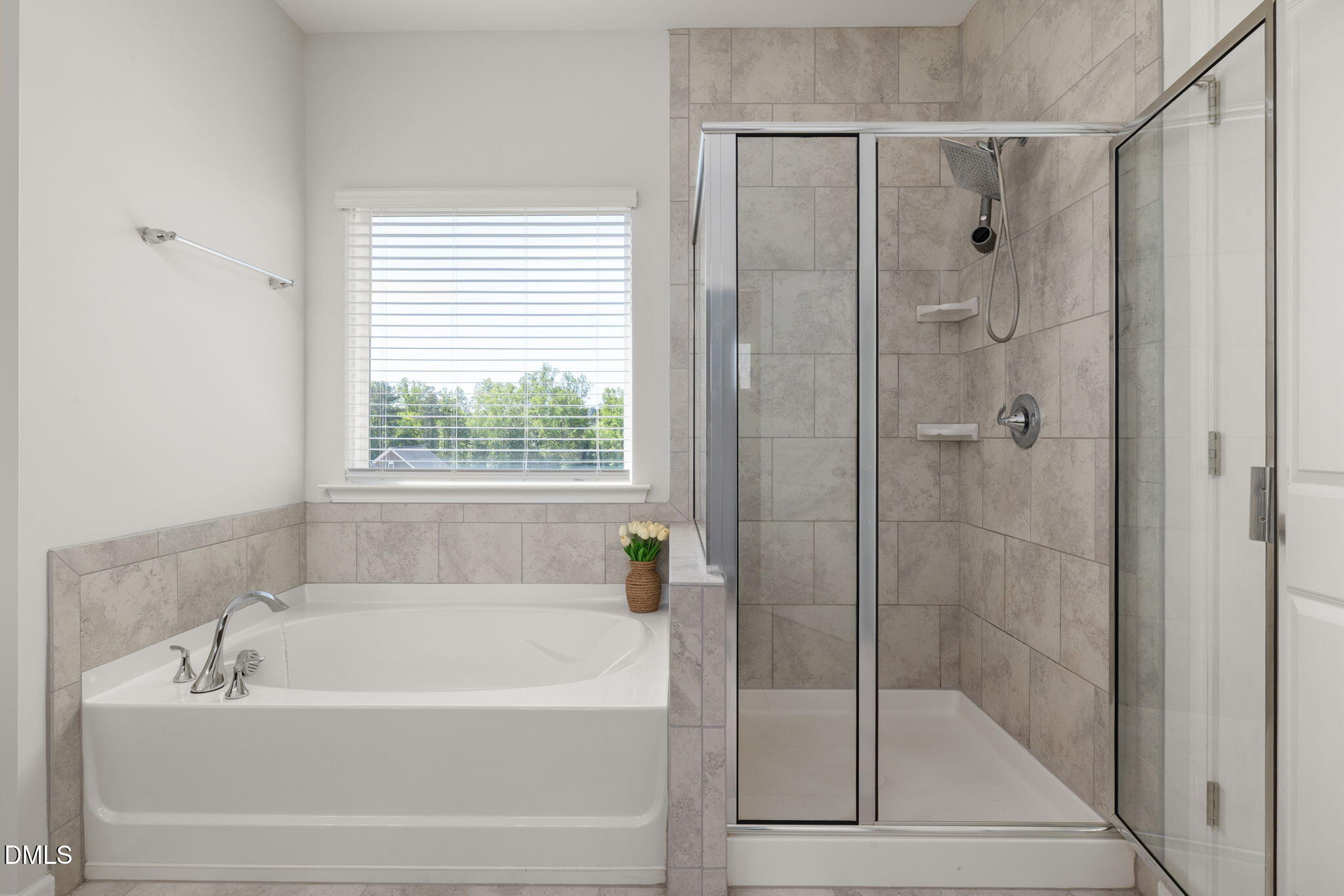 3422 Longleaf Estates Drive Raleigh, NC 27616 - Photo 37 of 71 a bathroom with a bathtub shower and window