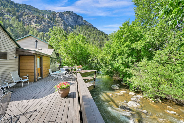 655 Ogden Canyon Road Ogden, UT 84401 - Photo 5 of 50 Expansive wood-finish deck overlooking a flowing stream with natural rock formations