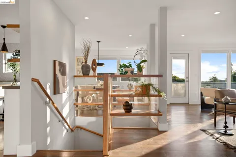 a kitchen with a sink a stove a refrigerator and black cabinets
