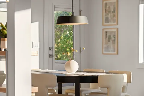 a bedroom with a bed and lamp