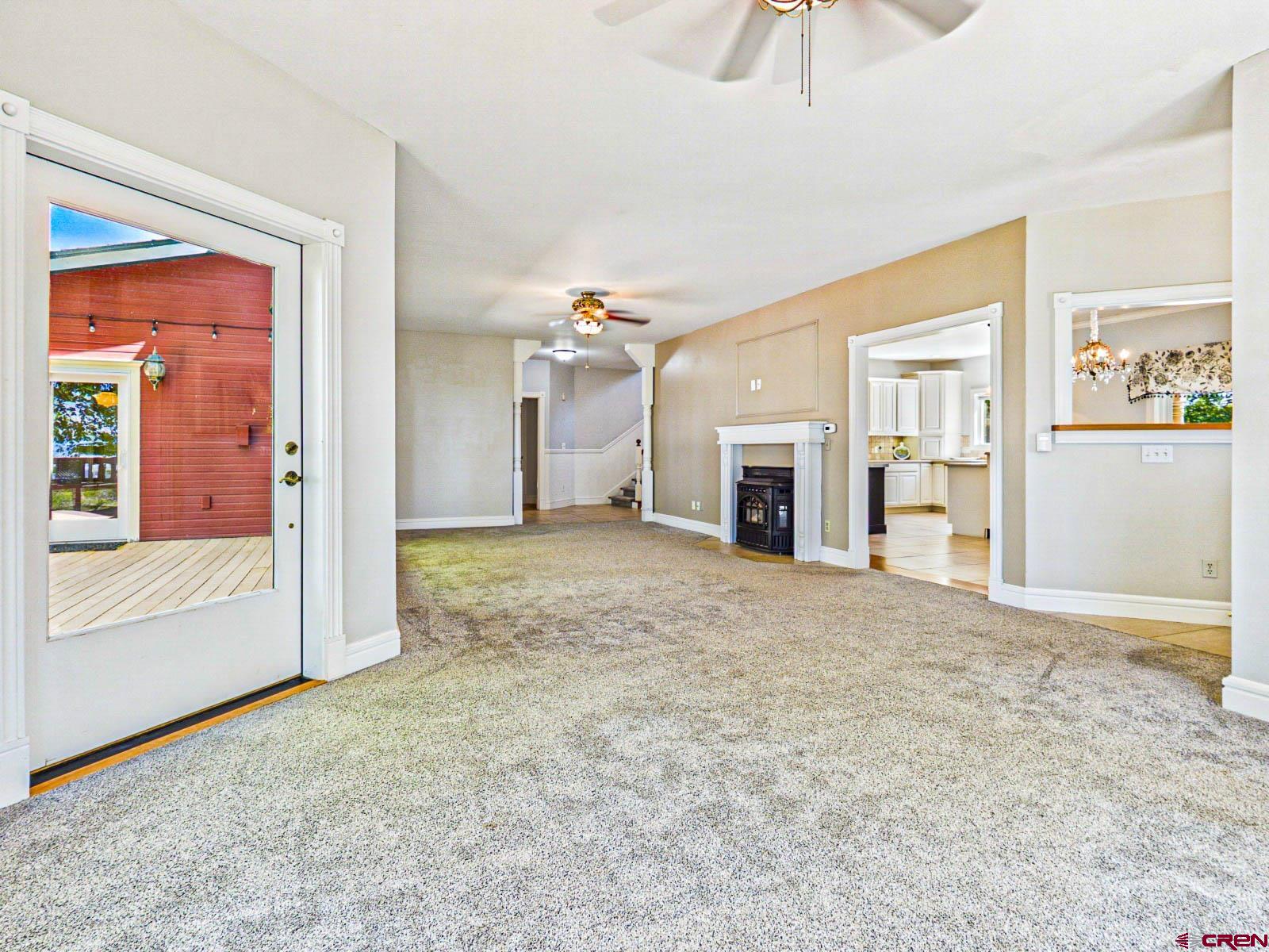 16331 2550th Road Cedaredge, CO 81413 - Photo 13 of 45 an empty room with cabinet and a fireplace