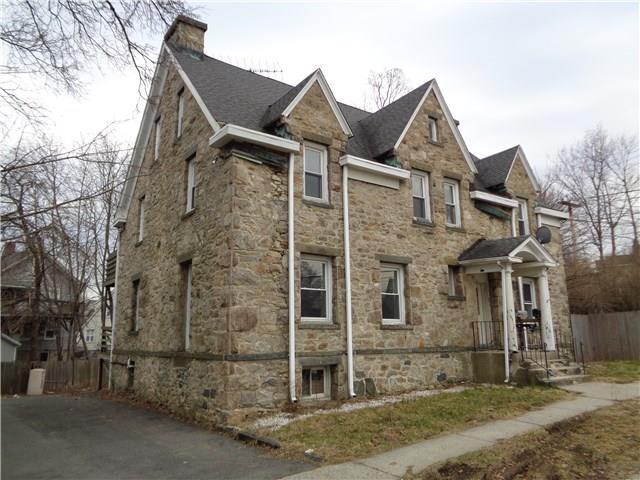 5 Peveril Road, Unit 3 Stamford, CT 06902 - Photo 1 of 1 a front view of a house with a yard
