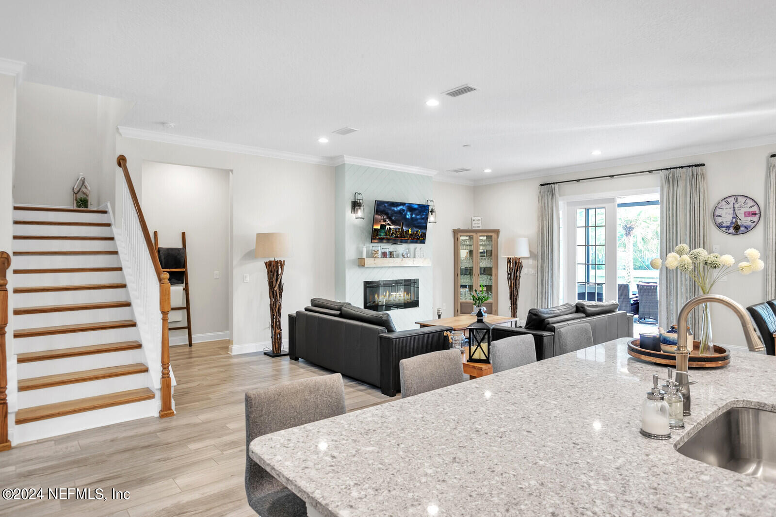 240 Pine Haven Drive St. Johns, FL 32259 - Photo 15 of 46 a living room with furniture a wooden floor and a large window
