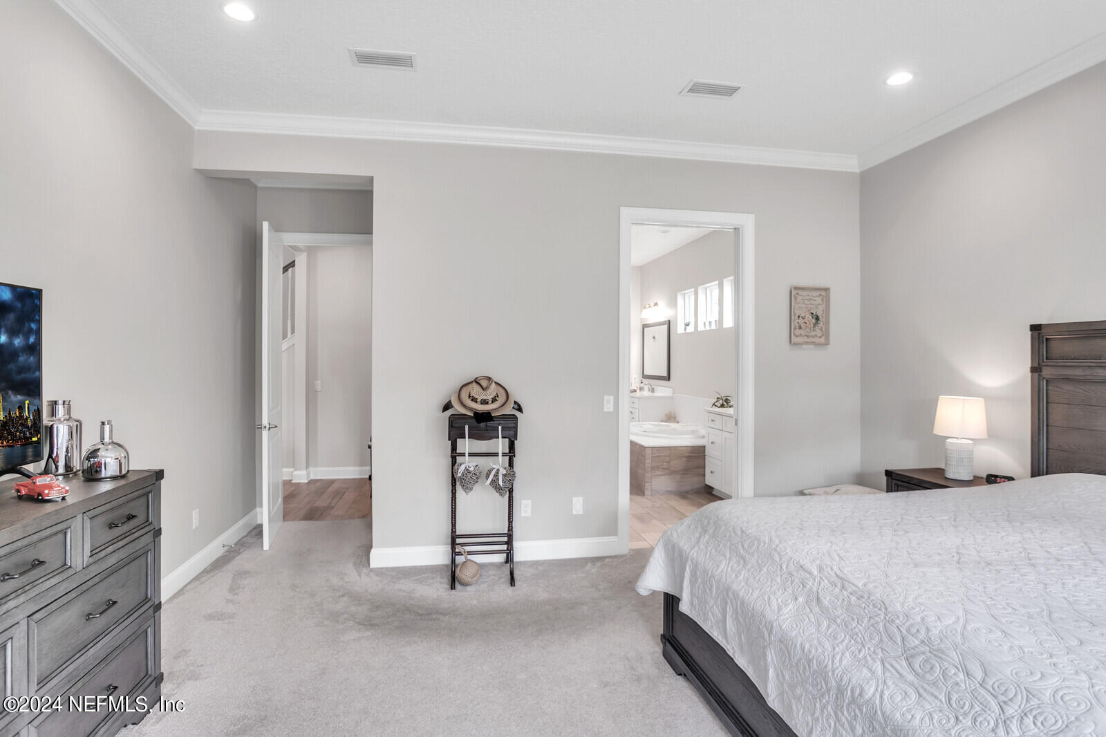 240 Pine Haven Drive St. Johns, FL 32259 - Photo 18 of 46 a bedroom with a bed and a lamp