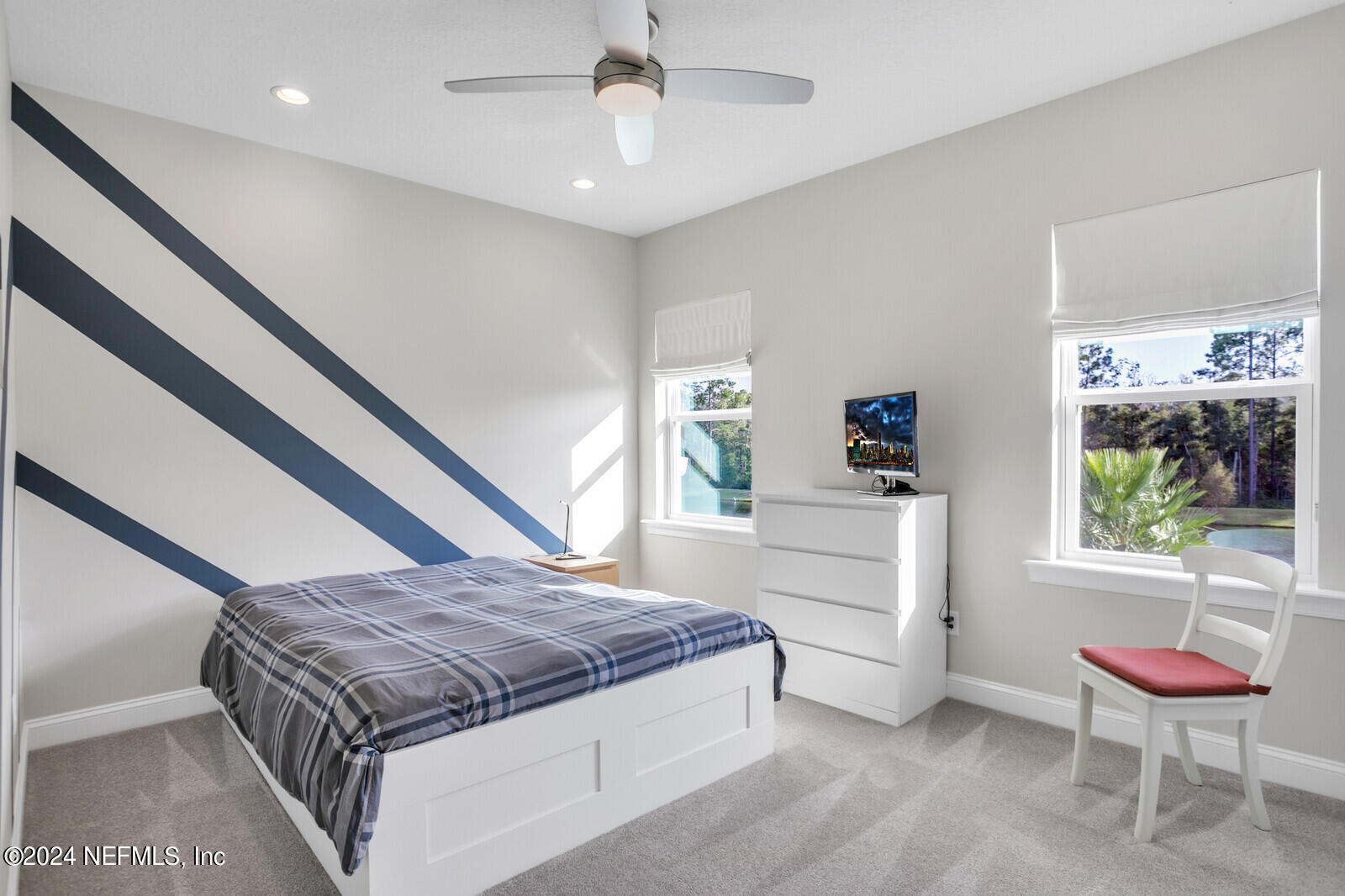 240 Pine Haven Drive St. Johns, FL 32259 - Photo 26 of 46 a spacious bedroom with a bed and a window