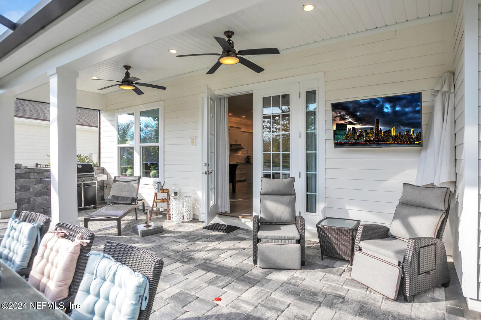 240 Pine Haven Drive St. Johns, FL 32259 - Photo 33 of 46 a living room with furniture a rug and a flat screen tv