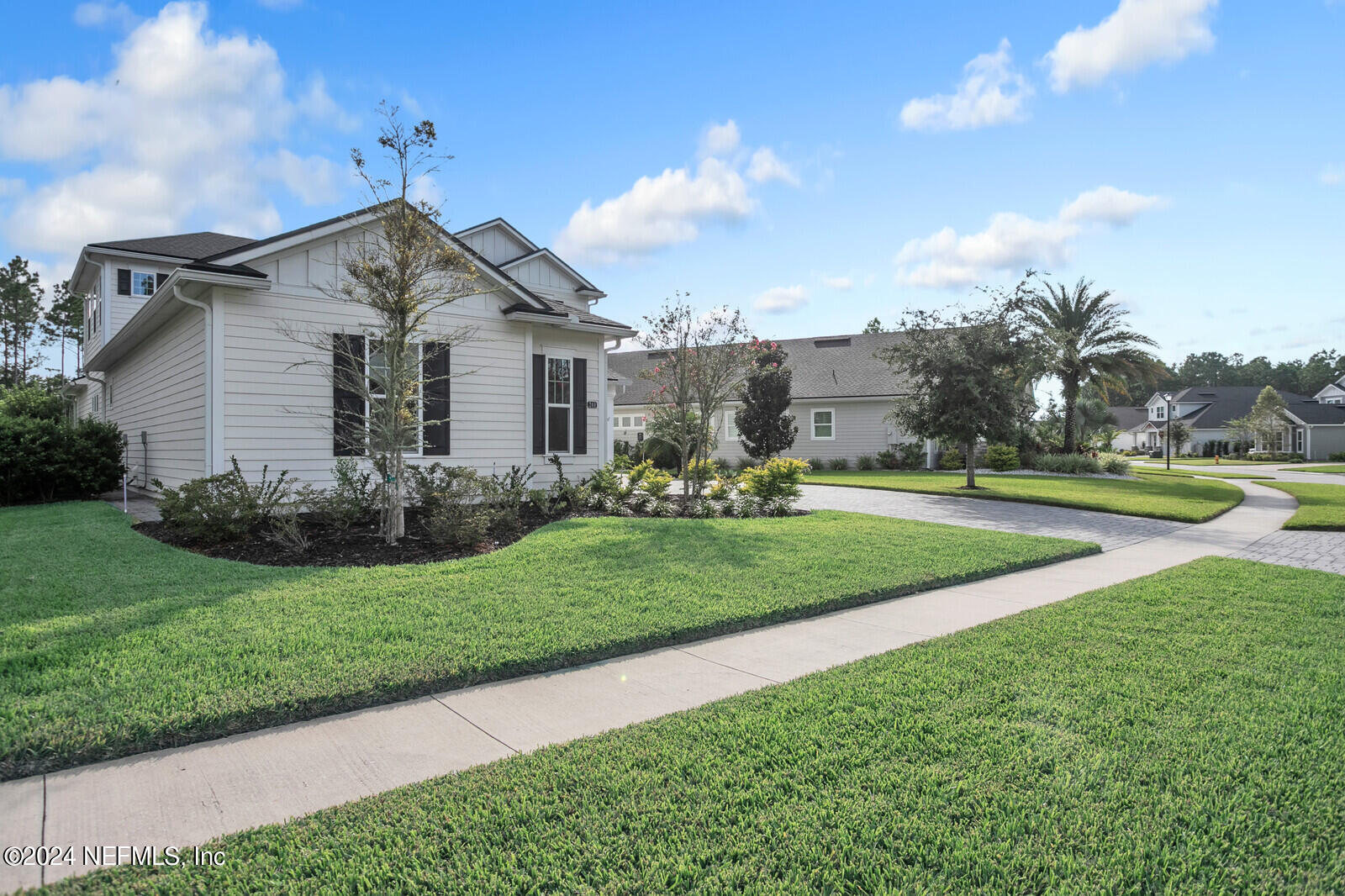 240 Pine Haven Drive St. Johns, FL 32259 - Photo 40 of 46 a front view of a house with garden