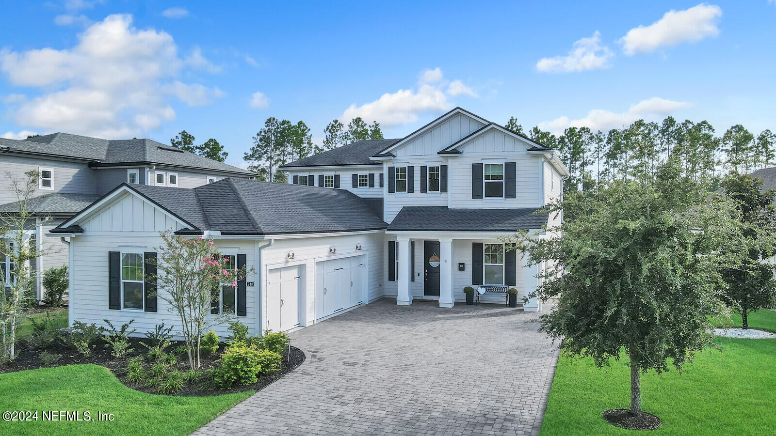 240 Pine Haven Drive St. Johns, FL 32259 - Photo 45 of 46 a front view of a house with a yard and garage