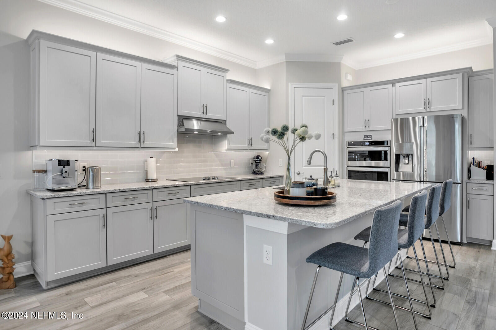 240 Pine Haven Drive St. Johns, FL 32259 - Photo 10 of 46 a kitchen with kitchen island granite countertop a sink stainless steel appliances and cabinets