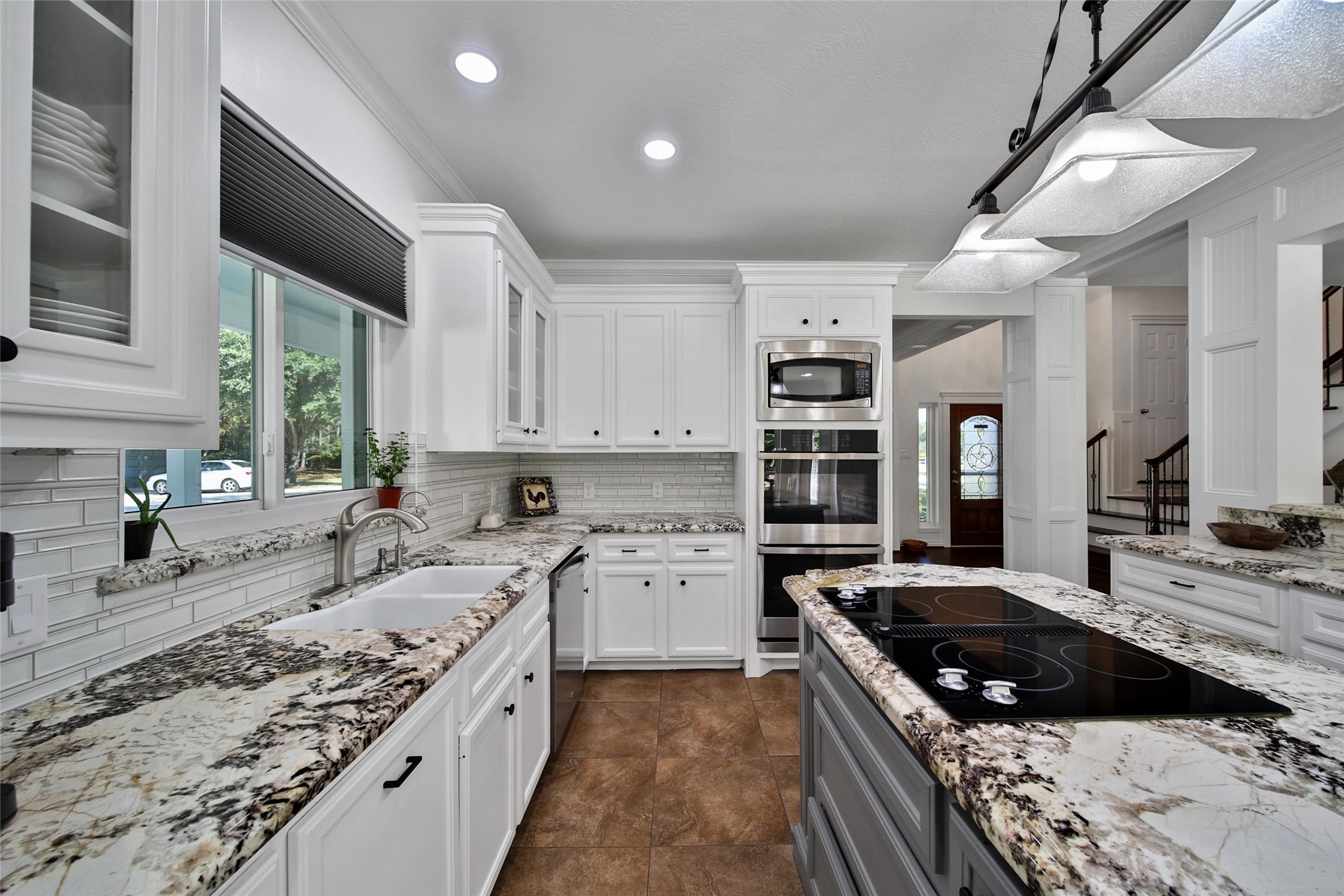 29919 Tudor Way Magnolia, TX 77355 - Photo 11 of 50 a kitchen with a stove sink and cabinets