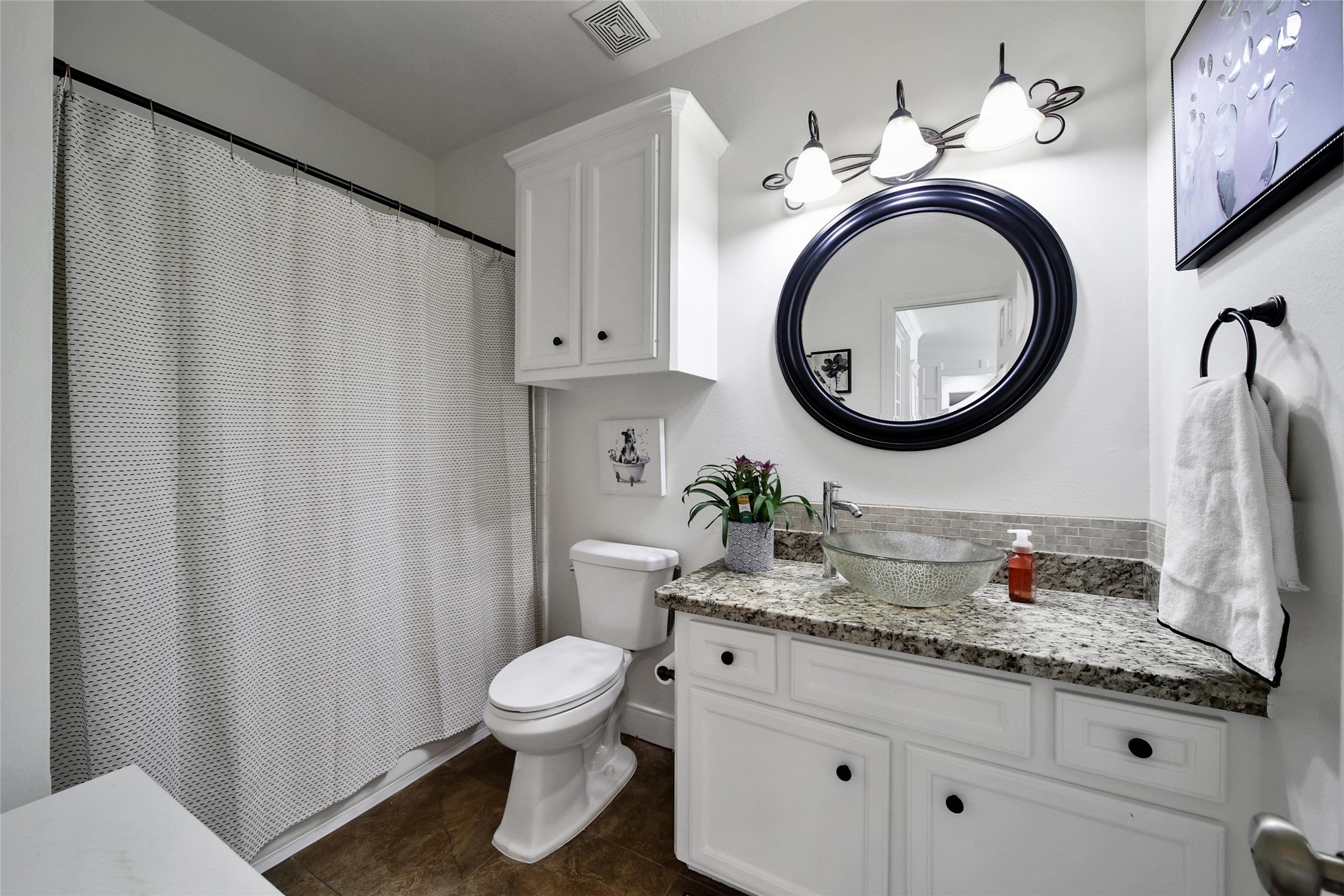 29919 Tudor Way Magnolia, TX 77355 - Photo 20 of 50 a bathroom with a granite countertop toilet sink and mirror