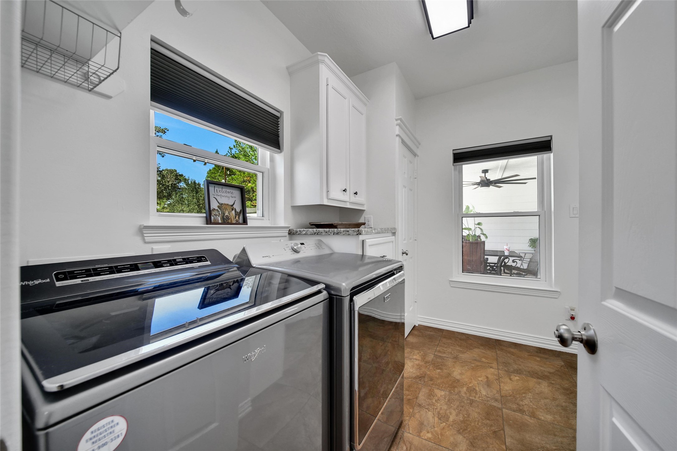 29919 Tudor Way Magnolia, TX 77355 - Photo 29 of 50 a kitchen that has a sink a stove and a window