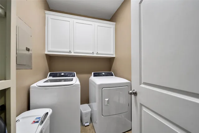a view of bathroom with a washer and dryer