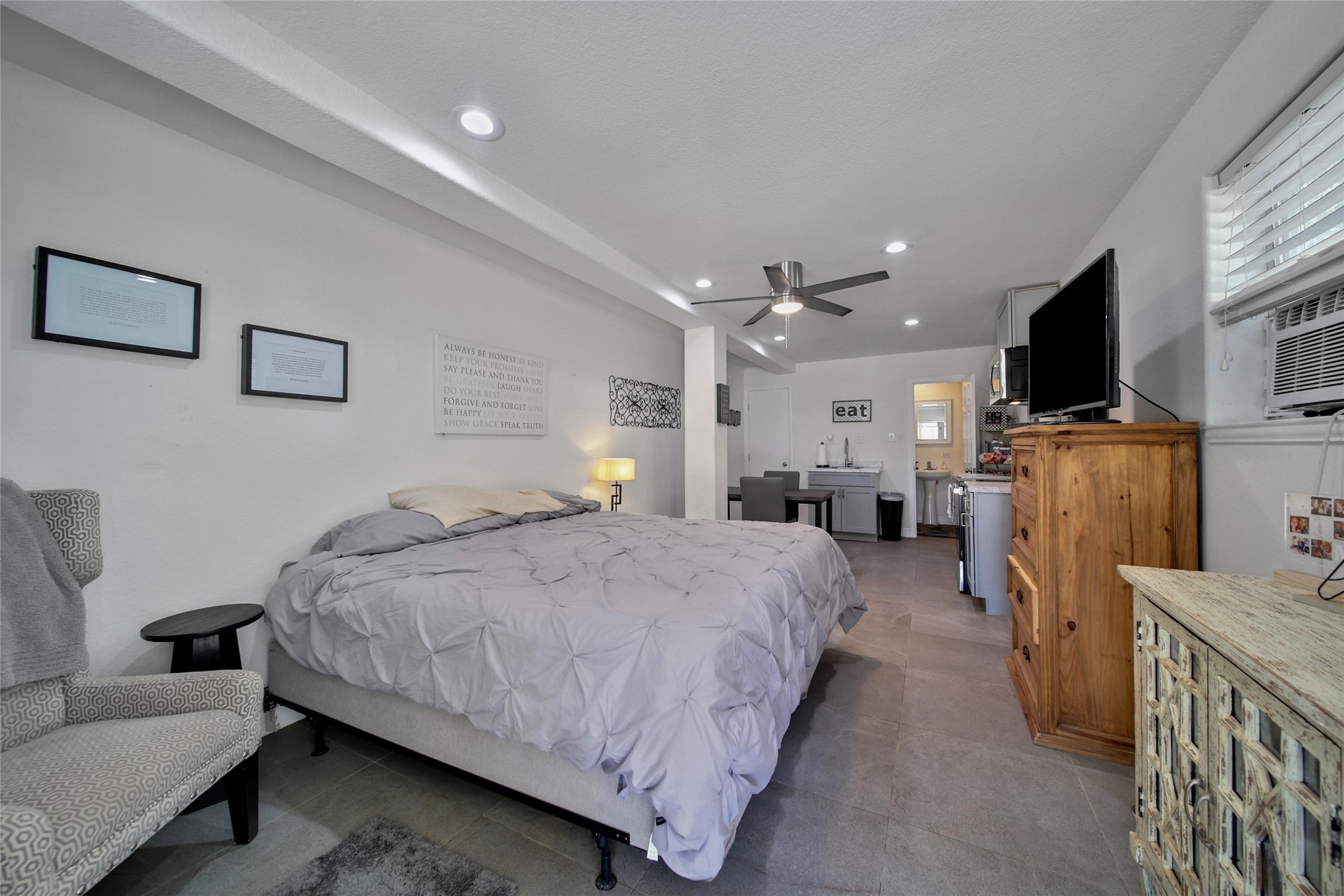 29919 Tudor Way Magnolia, TX 77355 - Photo 44 of 50 a spacious bedroom with a bed and a flat screen television