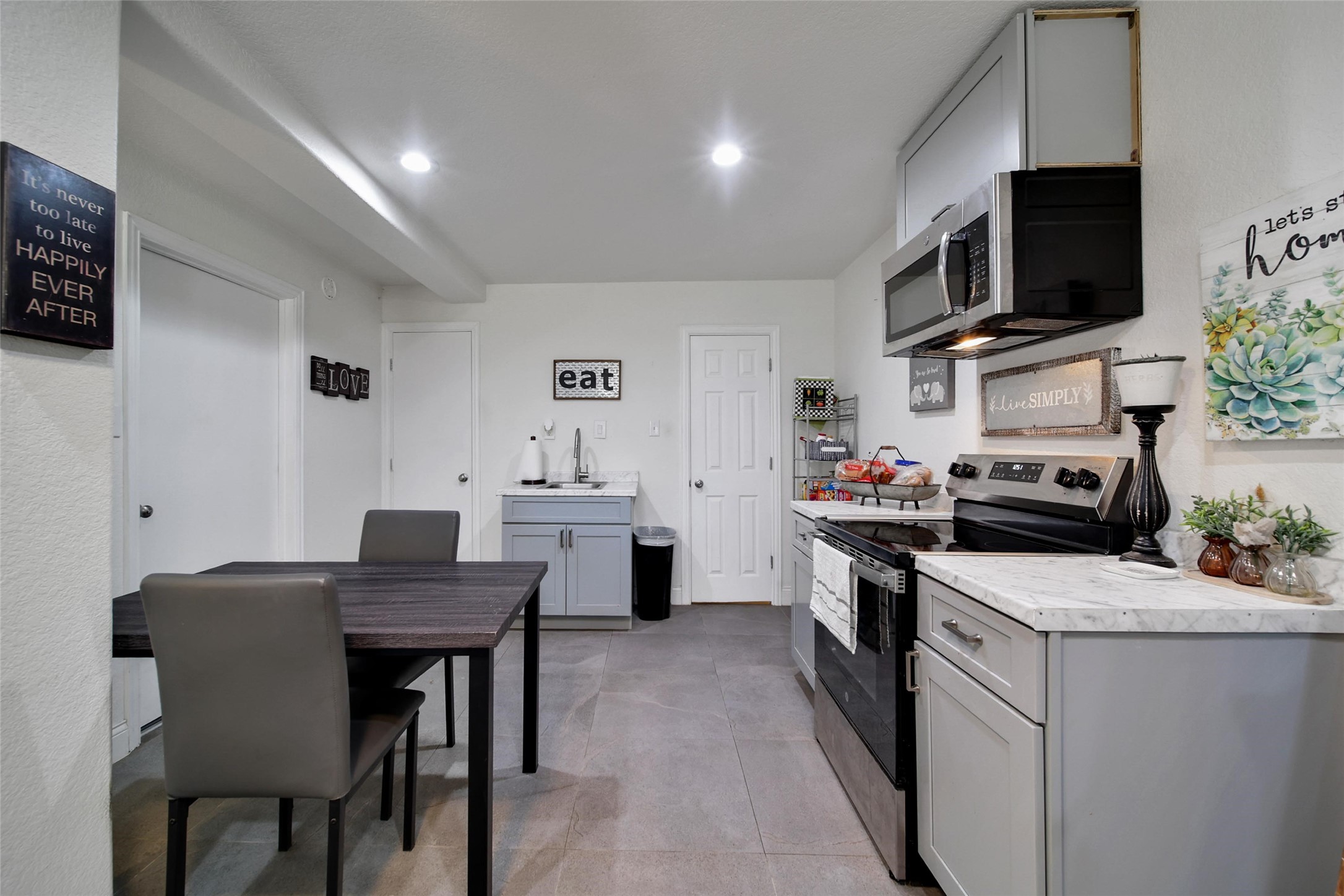 29919 Tudor Way Magnolia, TX 77355 - Photo 45 of 50 a kitchen that has a table and chairs in it