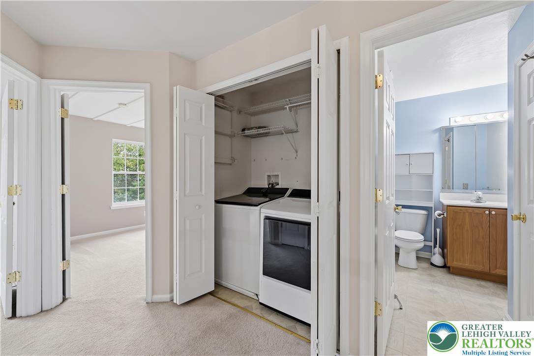 5607 Spring Ridge Drive West Macungie, PA 18062 - Photo 13 of 26 A convenient second-floor laundry closet stands directly adjacent to a full bathroom.